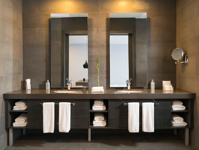 A bathroom with twin sinks