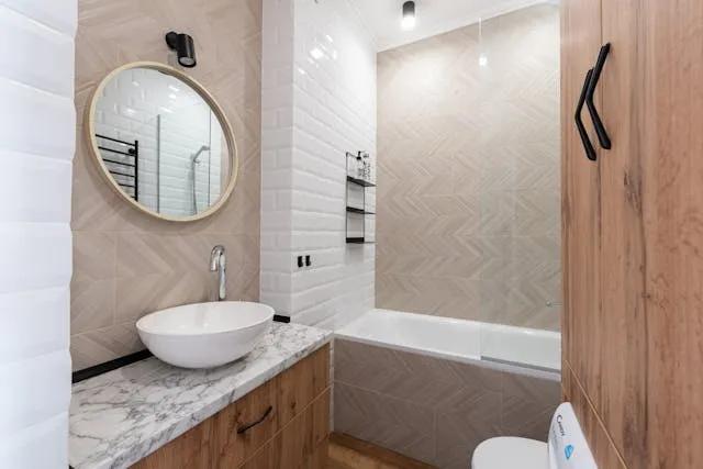 A remodeled bathroom with a wood finish