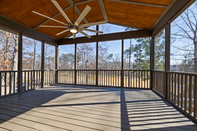 A deck with a ceiling fan