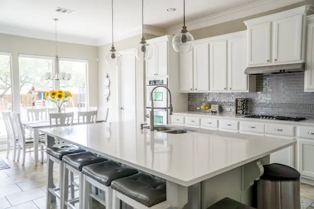 A beautiful sun lit white kitchen