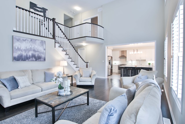 A living room with high ceiling and stairs