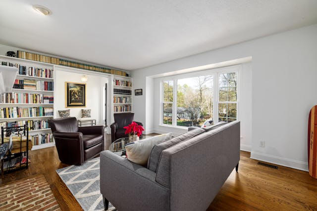 A living room with a library